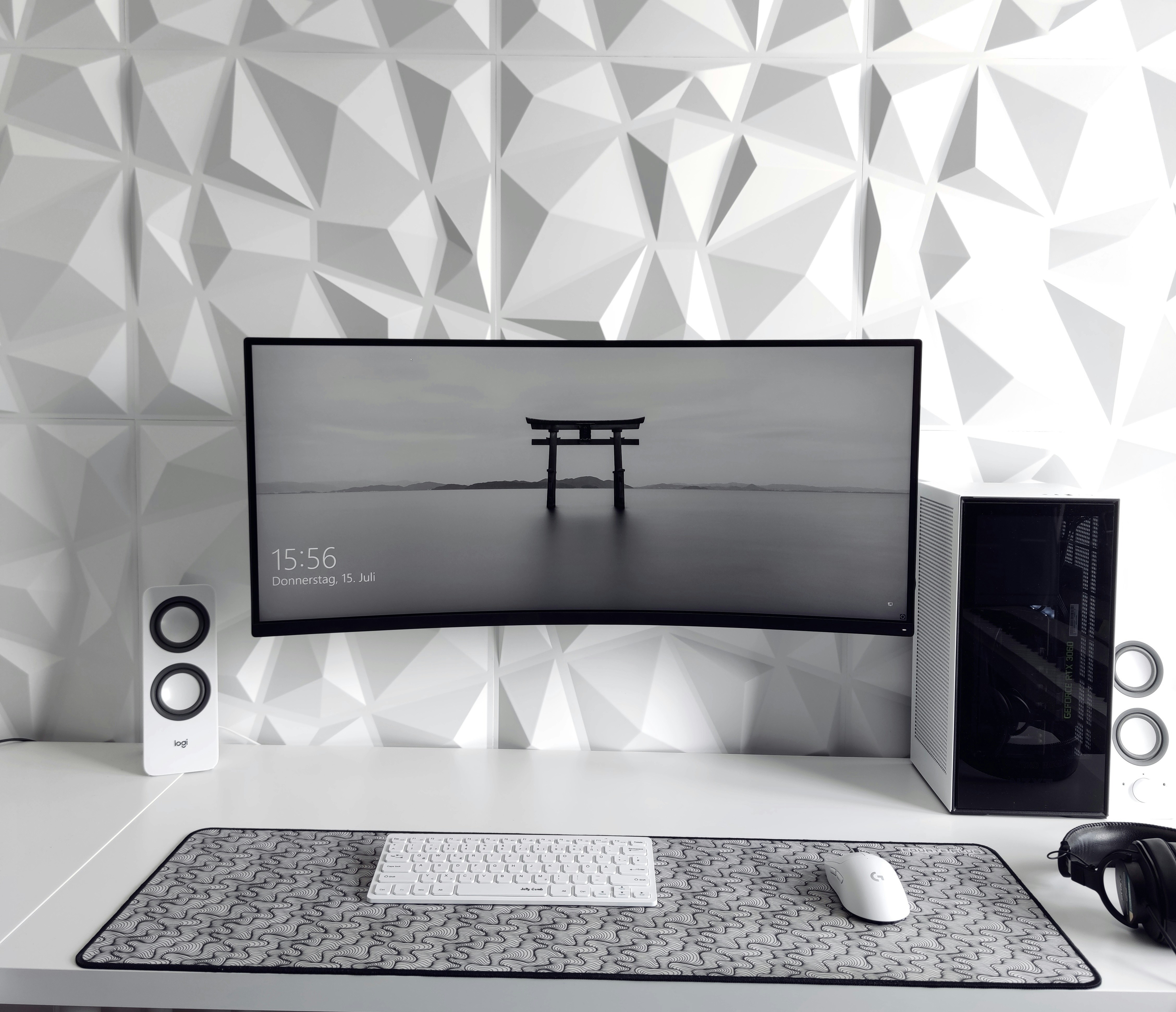a computer monitor sitting on top of a desk