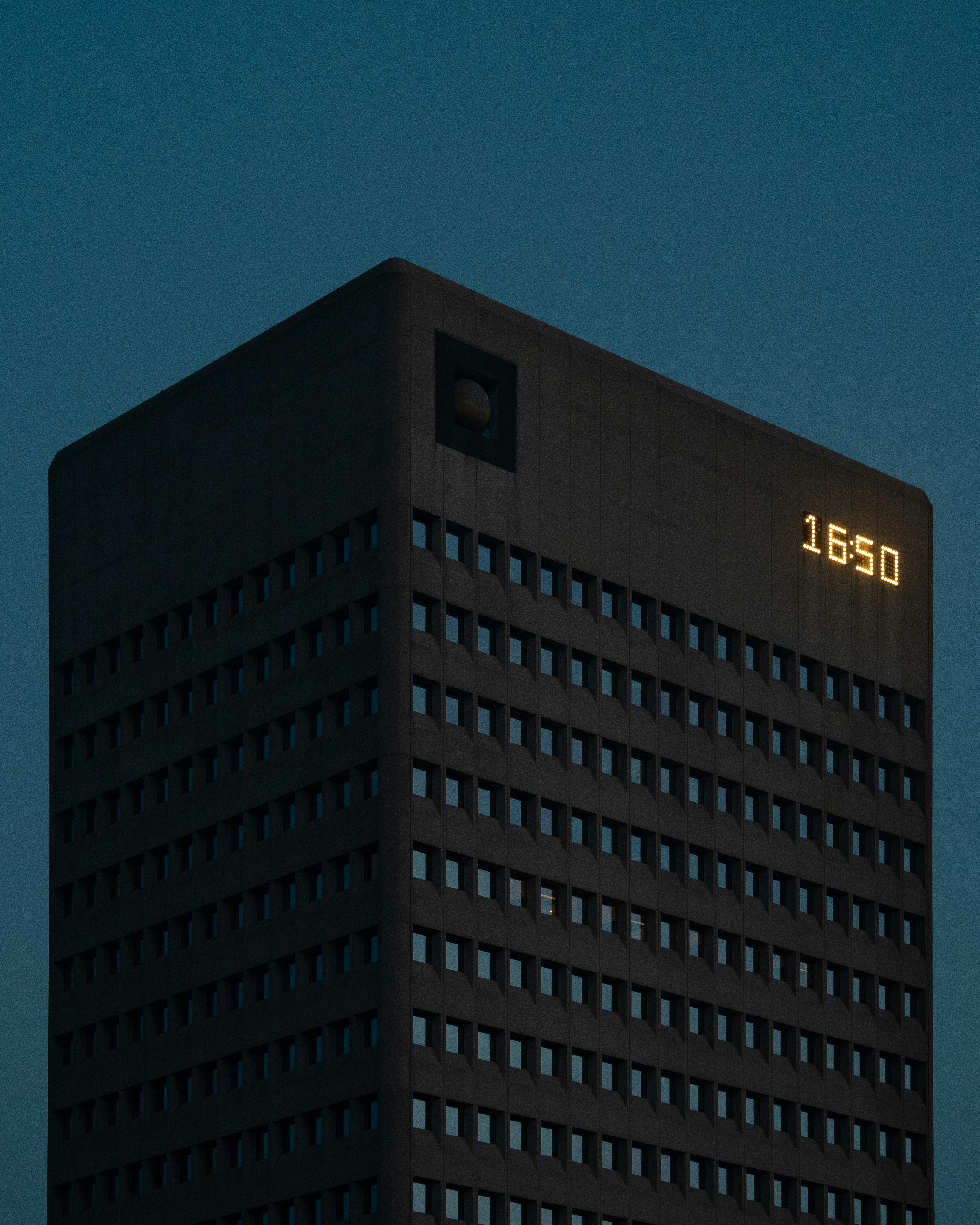 a tall building with a clock on the side of it